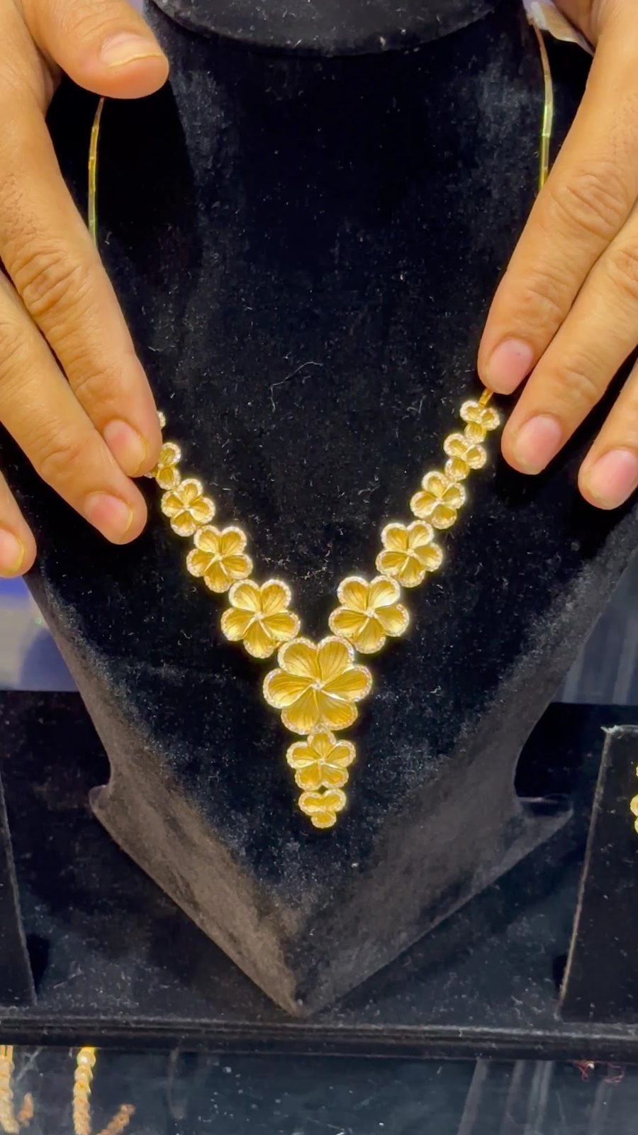 Light gold floral necklace from the tray