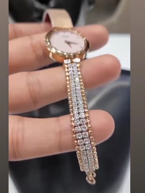 Ladies gold watch with a diamond strap